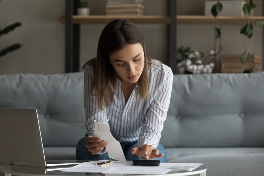 Woman does paperwork on a table